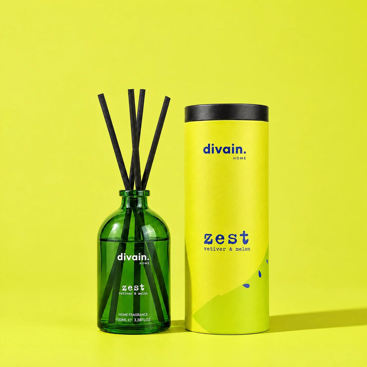 divain. Zest reed diffuser with its tube on a lime green background