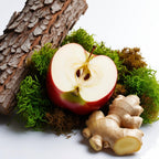 Apple, ginger, moss and wood representing the olfactory notes of the perfume.
