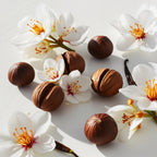 Hazelnut and orange blossom representing the olfactory notes of the perfume.