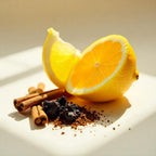 Lemon, praline and black cardamom representing the olfactory notes of the perfume.