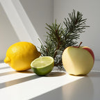 Lemon, lime and apple representing the olfactory notes of the perfume.