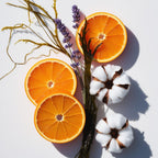 Orange, cotton flower and lavender representing the olfactory notes of the perfume.