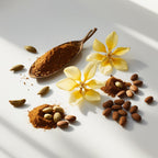 Mimosa and tonka bean representing the olfactory notes of the perfume.