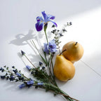 Pear and lavender representing the olfactory notes of the perfume.