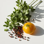 Pepper and oregano representing the olfactory notes of the perfume.
