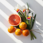 Iris and grapefruit representing the olfactory notes of the perfume.