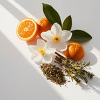 Orange blossom and patchouli representing the olfactory notes of the perfume.