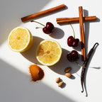 Cinnamon, cherry and lemon representing the olfactory notes of the perfume.