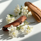 Cedar and jasmine representing the olfactory notes of the perfume.