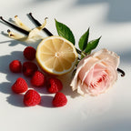 Lemon, raspberry and rose representing the olfactory notes of the perfume.
