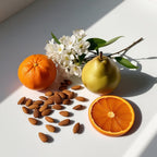 Clementine, pear, jasmine and almond representing the olfactory notes of the perfume.