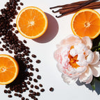 Mandarin, peony and coffee beans representing the olfactory notes of the perfume.