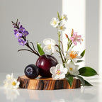 Plum, jasmine, violet and wood representing the olfactory notes of the perfume.