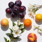 Plum, lemon, orange and jasmine representing the olfactory notes of the perfume.