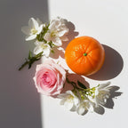 Mandarin, rose and jasmine representing the olfactory notes of the perfume.