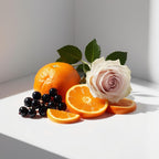 Rose, mandarin and blackcurrant leaves representing the olfactory notes of the perfume.