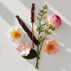 Tuberose, jasmine and orange blossom representing the olfactory notes of the perfume.