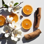 Orange, jasmine and wood representing the olfactory notes of the perfume.