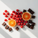 Mandarin and raspberry representing the olfactory notes of the perfume.