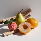 Lychee, pear and wood representing the olfactory notes of the perfume.