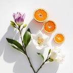 Mandarin, orange blossom and rose representing the olfactory notes of the perfume.