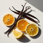 Orange, lemon and vanilla representing the olfactory notes of the perfume.