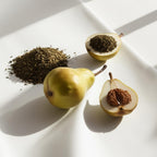 Pear and musk representing the olfactory notes of the perfume.