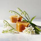 Beeswax, jasmine and lily representing the olfactory notes of the perfume.