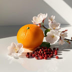 Mandarin, cherry blossom and pink pepper representing the olfactory notes of the perfume.