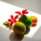 Lime, mandarin and tiare flower representing the olfactory notes of the perfume.