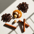 Coffee, walnut and cinnamon representing the olfactory notes of the perfume.