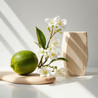 Lime, jasmine and wood representing the olfactory notes of the perfume.