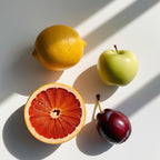 Grapefruit, apple and plum representing the olfactory notes of the perfume.