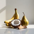 Coconut, banana and pear representing the olfactory notes of the perfume.