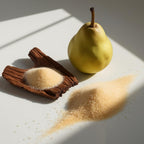Pear, sugar and wood representing the olfactory notes of the perfume.